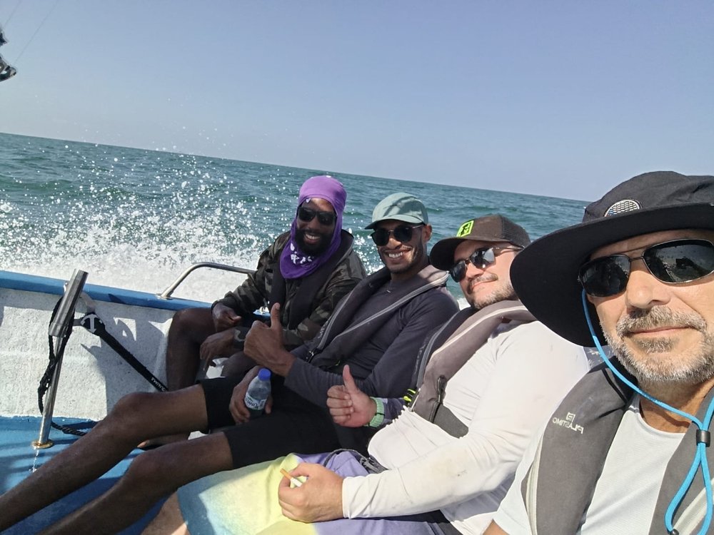 Quatre membres de l'équipe d'IPCO lors d'une sortie de pêche